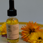 A bottle of Loomis Hill Botanicals' rose calendula jojoba oil.