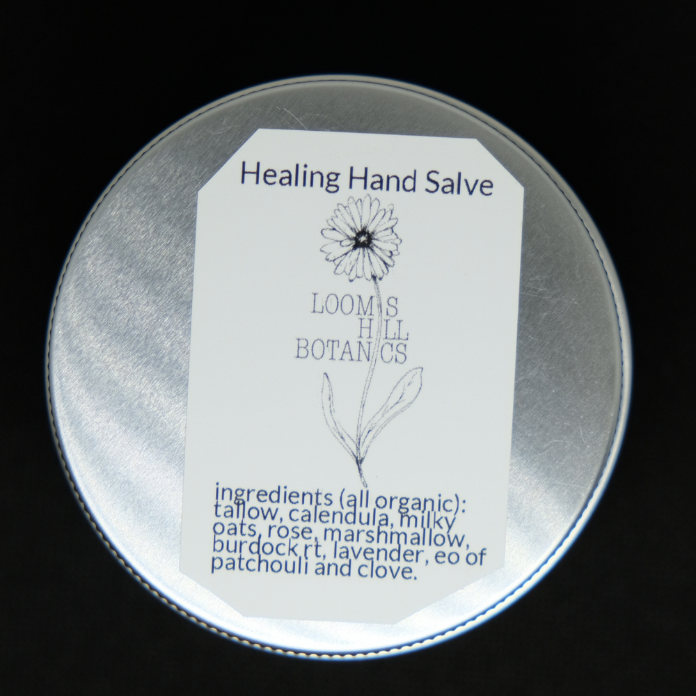 A tin of Loomis Hill Botanicals healing hand salve.